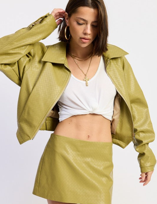 Olive green vegan leather mini skirt with high waist and zipper detail