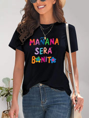 Black short-sleeve t-shirt with Manana Sera Bonita graphic and floral accents