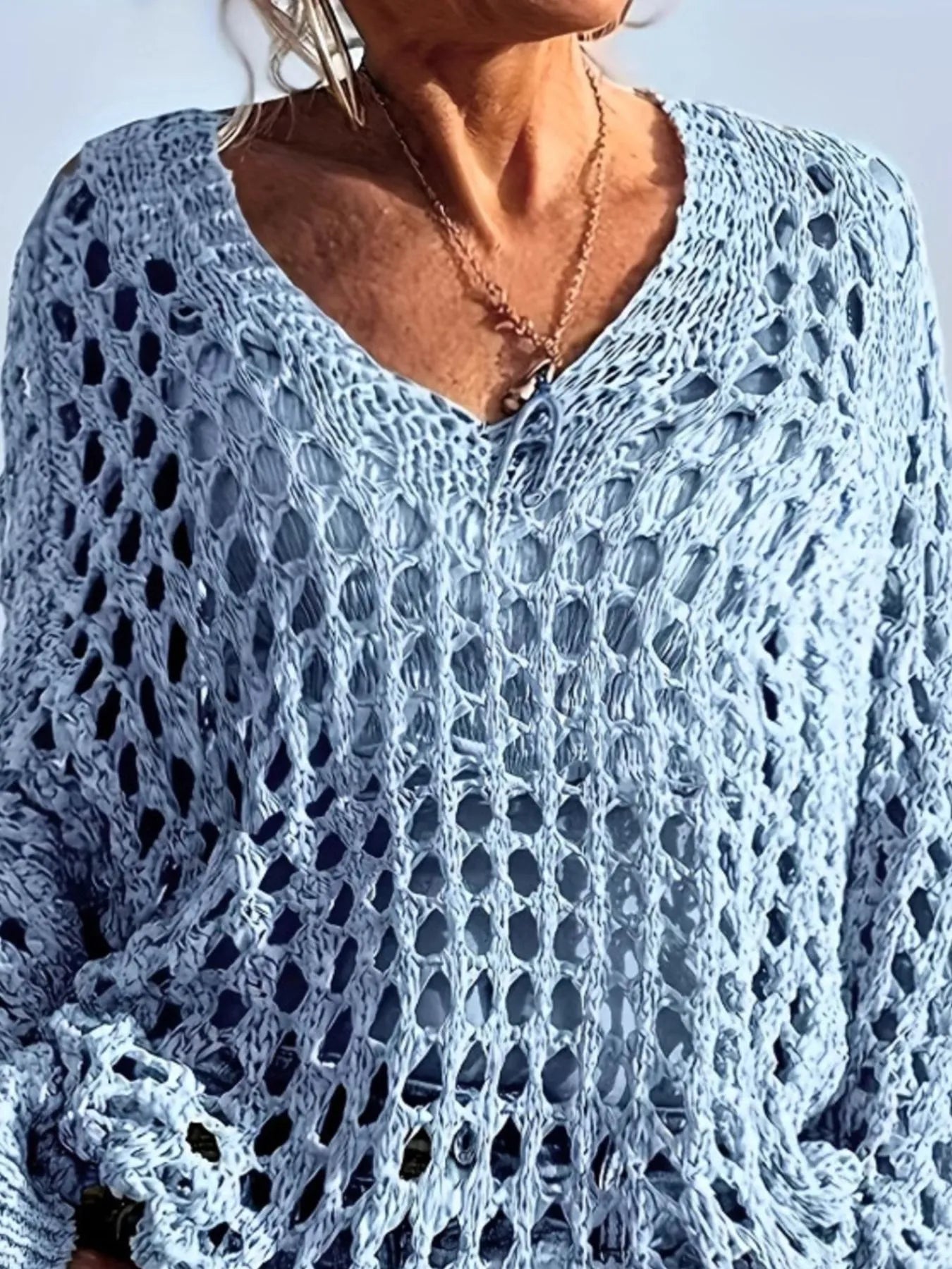 Light blue open-knit crochet top with V-neck and loose sleeves