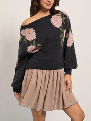 Black floral off-the-shoulder boat neck sweater with pleated skirt