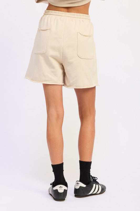 Beige French terry cotton shorts with elastic waistband and front pockets