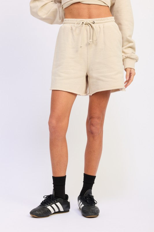 Beige French terry drawstring shorts with pockets and relaxed fit