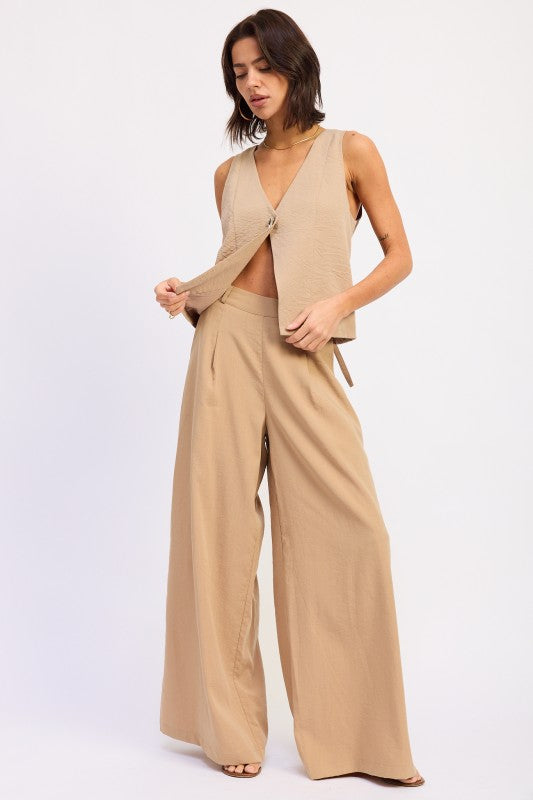 Beige v-neck sleeveless vest with front tie detail