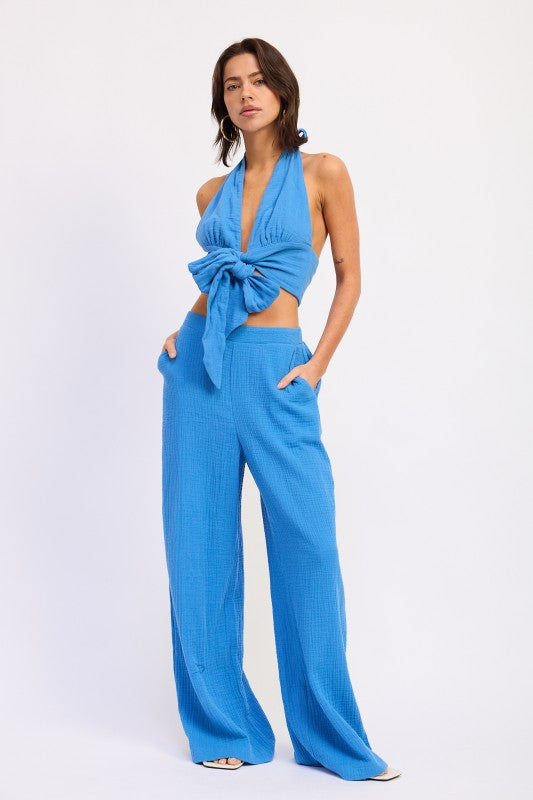 Vibrant blue double gauze halter neck crop top with tied knot and wide-leg pants