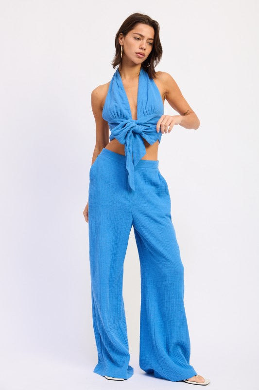 Vibrant blue textured double gauze halter neck crop top with front knot and wide-leg pants