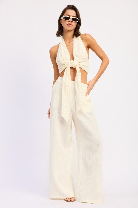 Cream halter top with knot and cutouts, paired with Double Gauze Palazzo Pants