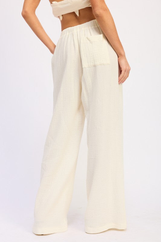 Cream-colored Double Gauze High Waist Palazzo Pants with wide-leg relaxed fit and subtle vertical ribbing