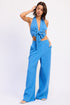 Vibrant blue textured halter top and high-waist palazzo pants outfit