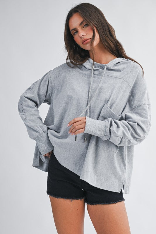 Relaxed pocket hoodie pullover top in soft heather gray with oversized fit