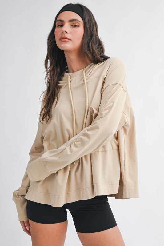 Beige oversized relaxed pocket hoodie pullover with drawstring hood and ruched sleeves