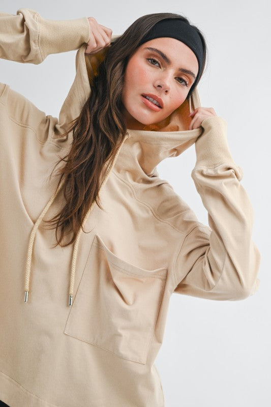 Beige relaxed pocket hoodie pullover top with front pocket and drawstrings
