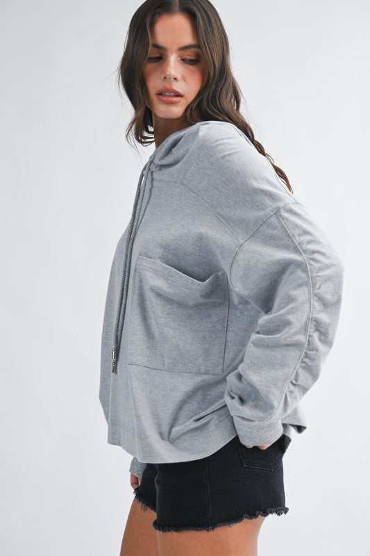 Gray relaxed fit oversized hoodie with ruched sleeves and pockets