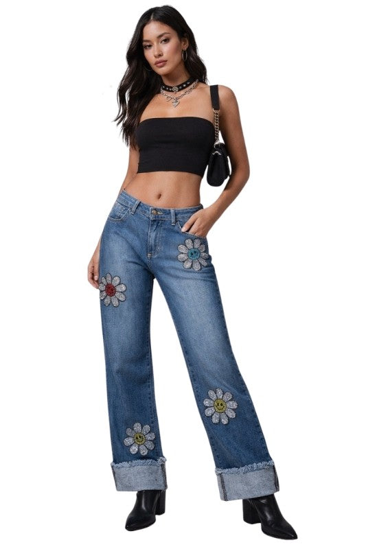 Junior low rise rhinestone daisy jeans with colorful embroidered flower patches and smiling faces on thighs and legs