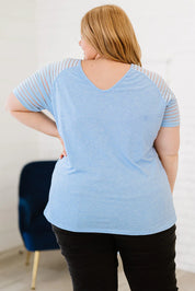 Plus size v-neck raglan sleeve tee in light blue and gray stripes