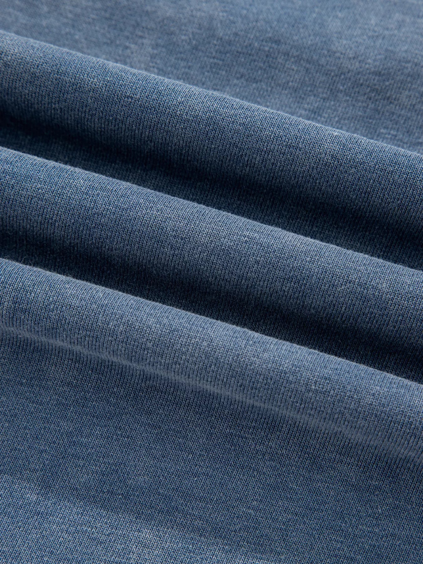 Soft heathered navy blue knit baggy sweatshirt with lace patchwork detail