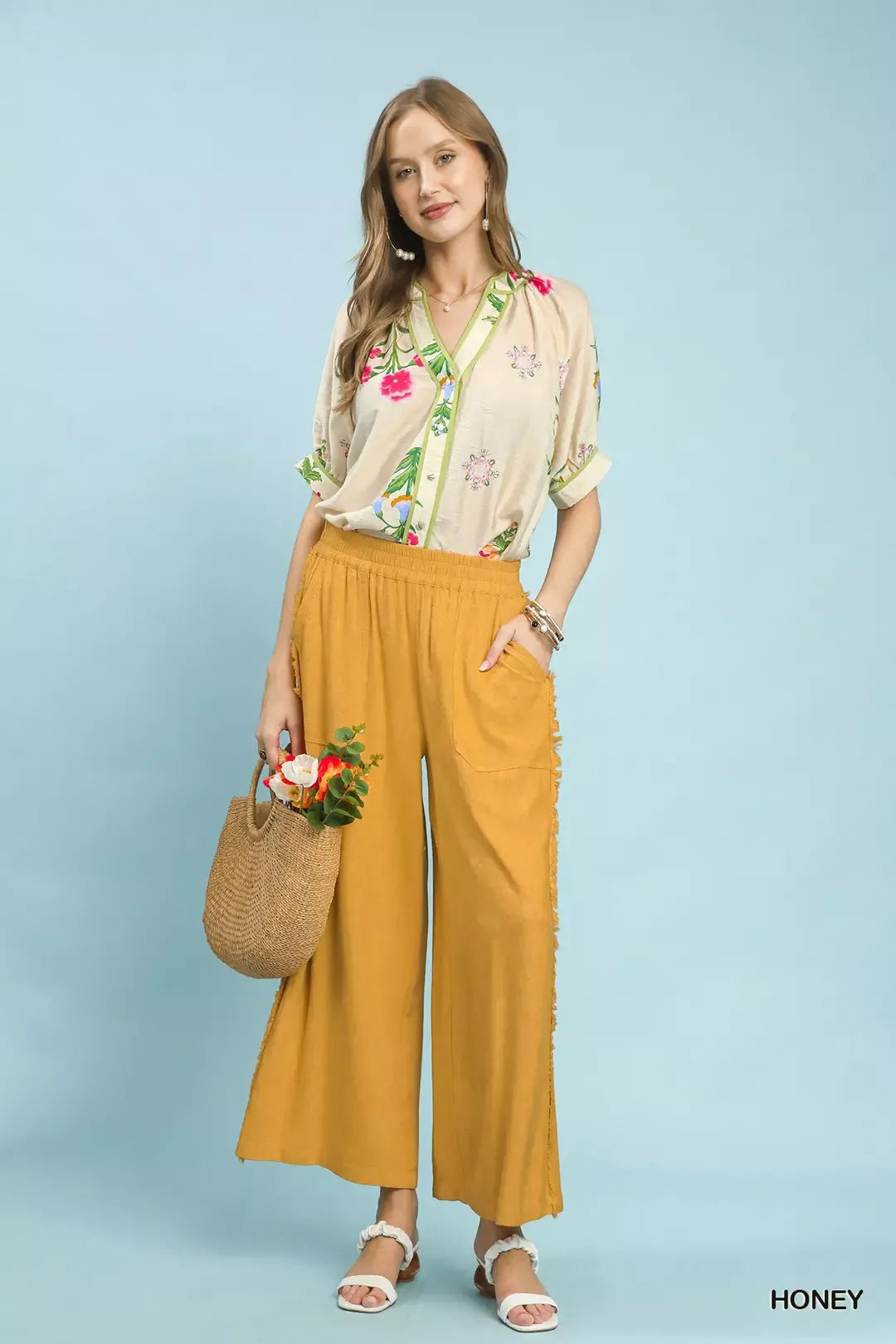 Woman in Umgee linen frayed side pocket wide leg pants with blouse