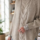 Beige full-size cable-knit turtleneck sweater with ribbed cuffs