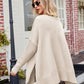 Beige v-neck slit exposed seam knit poncho with asymmetrical loose fit