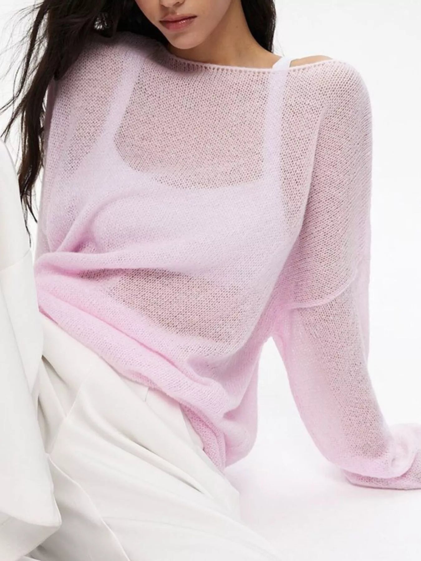 Delicate light pink boat neck dropped shoulder sweater with sheer texture and flowing sleeves