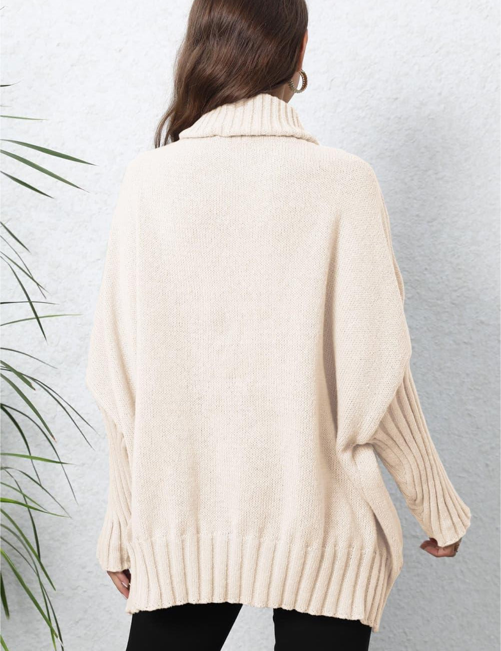 Cream oversized turtleneck sweater with ribbed detailing and batwing sleeves