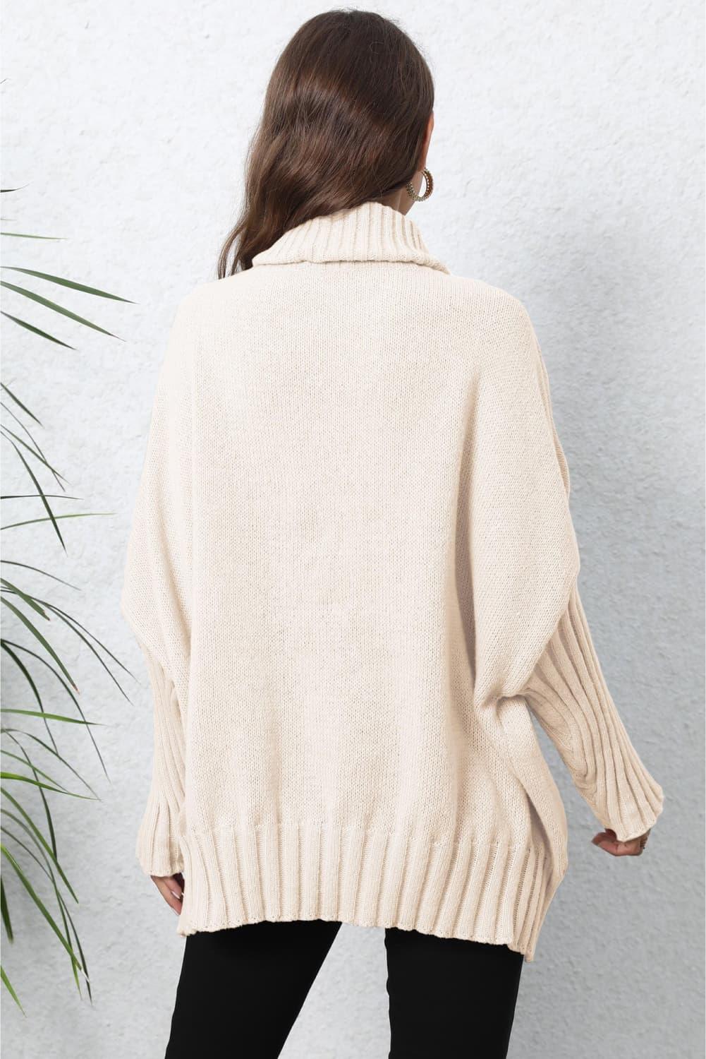 Cream oversized turtleneck sweater with ribbed detailing and batwing sleeves