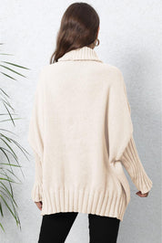 Cream oversized turtleneck sweater with ribbed detailing and batwing sleeves