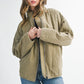 Olive green quilted Dixie Jacket puffer with front zipper and ribbed cuffs