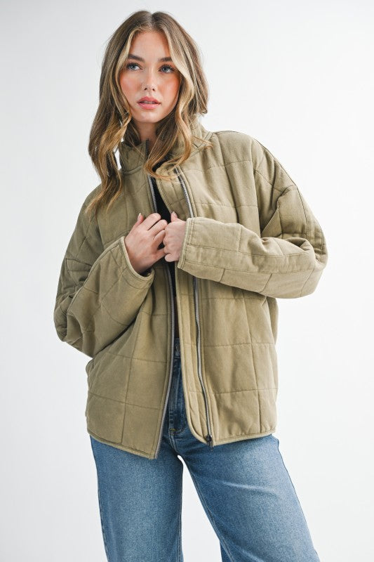 Olive green quilted Dixie Jacket puffer with front zipper and ribbed cuffs