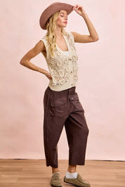 Cream lace vest with floral details and BiBi vintage mocha pants