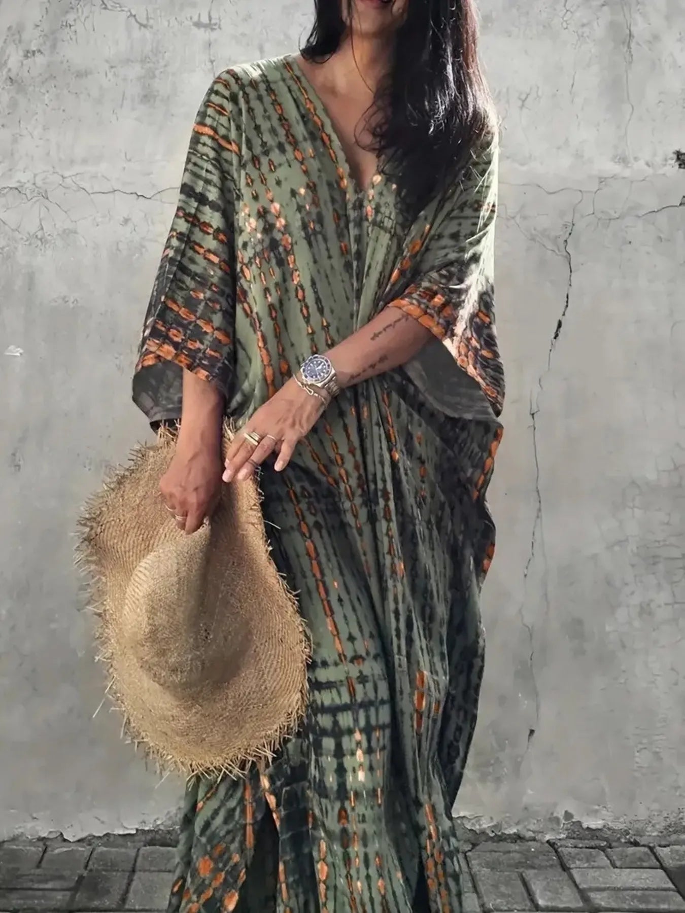 Flowing olive-green and orange tie-dye V-neck maxi dress with flowy sleeves