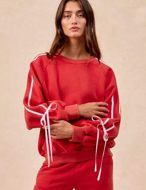 Red BiBi drawstring sweatshirt with white stripes and bow lace-up details
