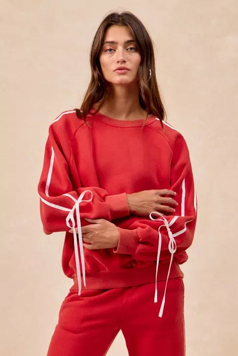 Red BiBi drawstring sweatshirt with white stripes and bow lace-up details