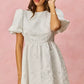 White textured floral jacquard dress with puffed sleeves and flared skirt