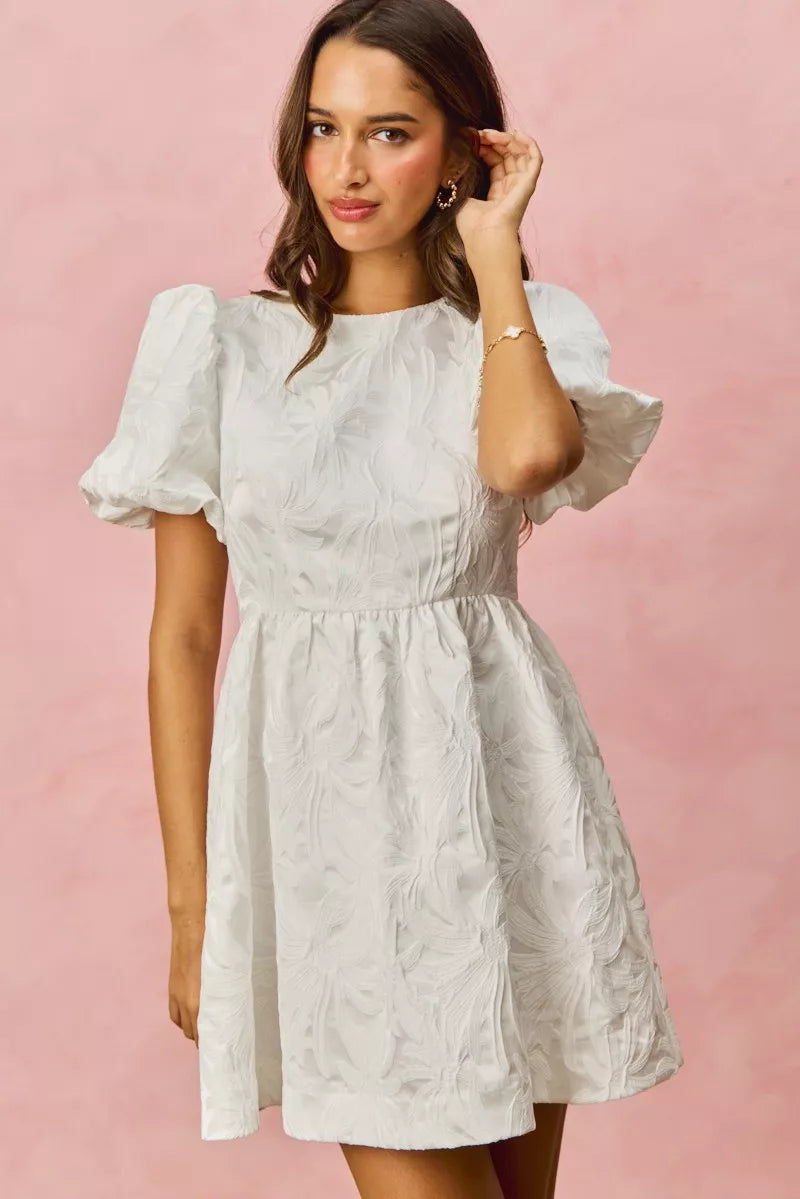 White textured floral jacquard dress with puffed sleeves and flared skirt