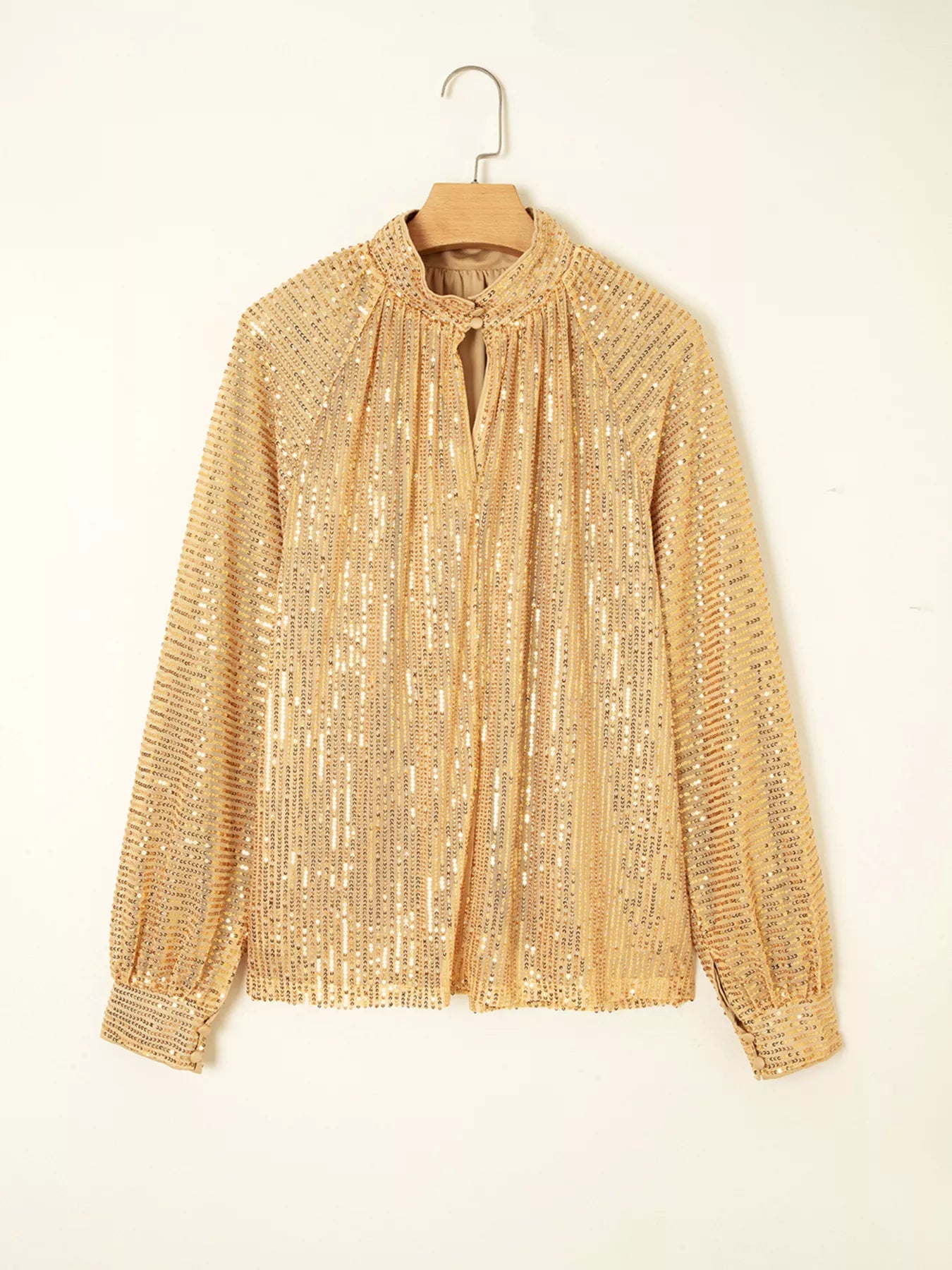 Gold sequined tie-neck blouse with balloon sleeves