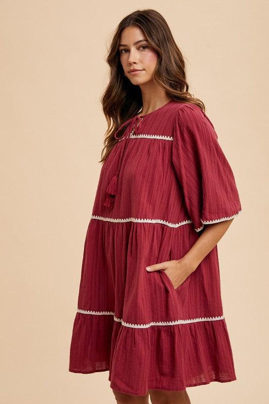Annie Wear Tassel Contrast Trim Tie Neck Half Sleeve Tiered Dress - DAVERRI FASHIONS
