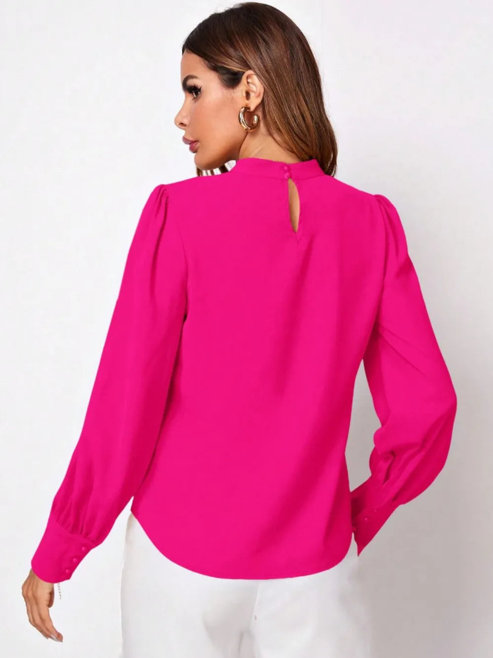 Vibrant fuchsia ruched mock neck long sleeve blouse with puffed sleeves