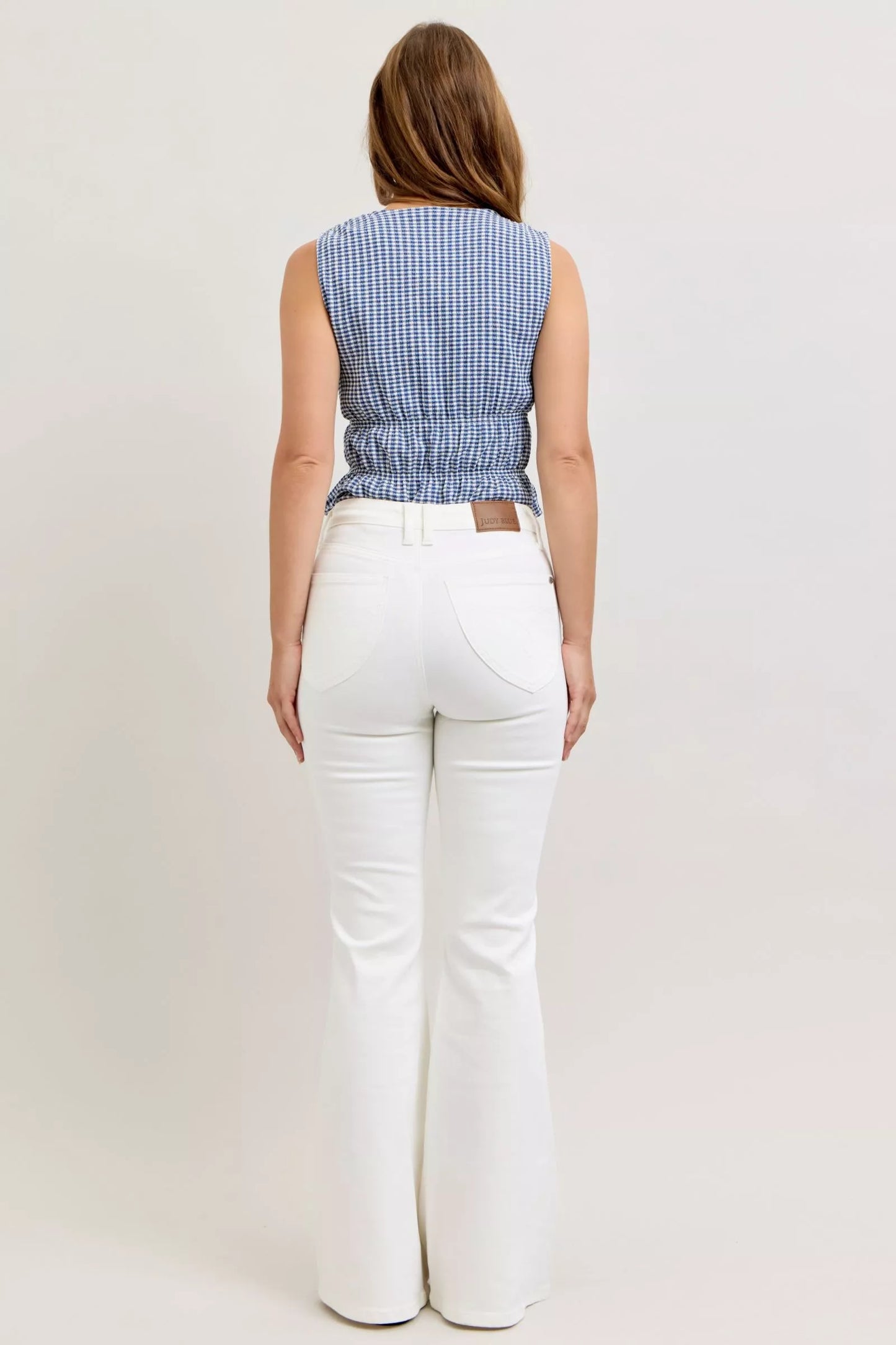 Judy Blue white high-waisted tummy control flare jeans with tailored fit and subtle stitching
