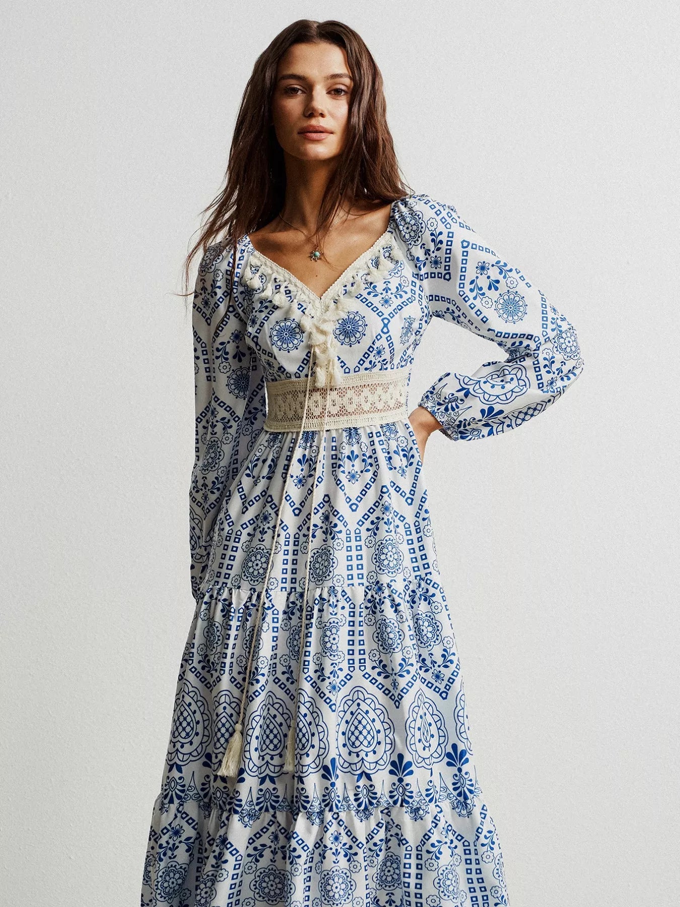 Blue and white bohemian print maxi dress with lace trim and tassel detail from Free People
