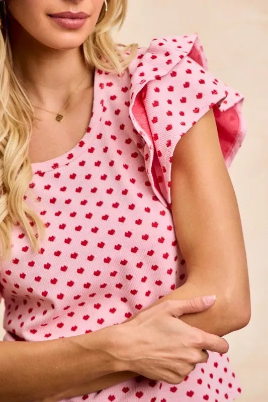 BiBi Heart Patterned Knit Ruffled Sleeves Top in pink with red hearts