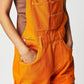 Daverri square neck wide strap denim shortalls in bright orange with pockets and silver buttons