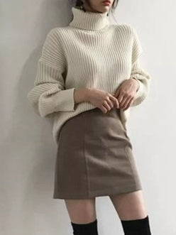 Cream-colored ribbed knit oversized turtleneck sweater plus size