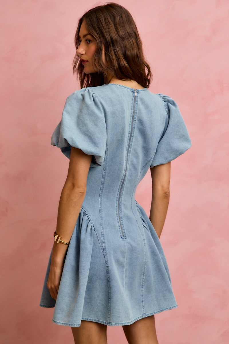 Back view of SO ME Bubble Sleeves light blue denim fit and flare mini dress with puffed sleeves and fitted back