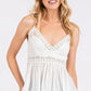 White lace-trimmed Mittoshop crisscross back V-neck cami with peplum hem