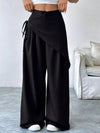 Daverri wrap-front wide-leg pants in black with draped asymmetrical design and side tie detail