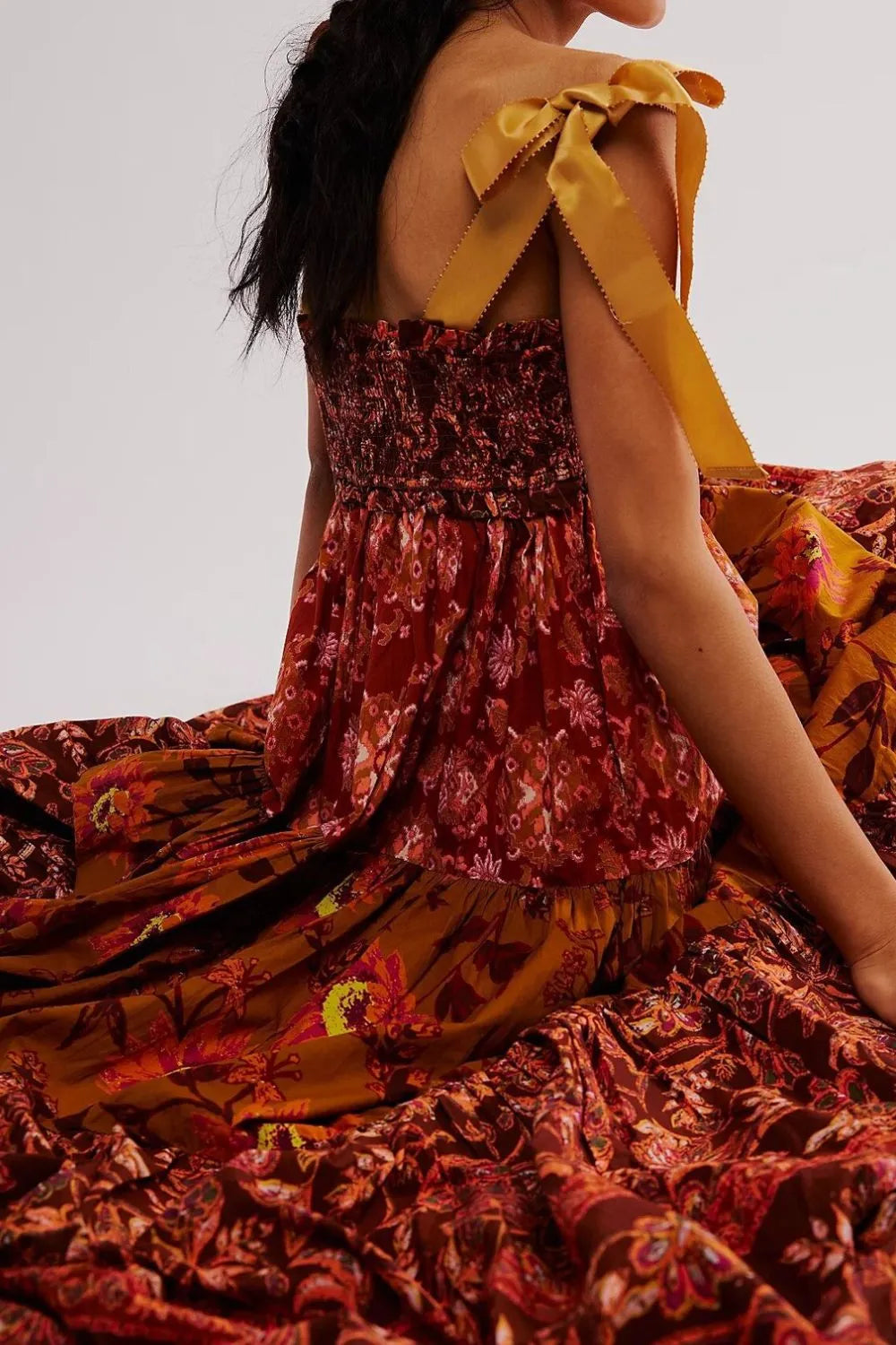 Floral tiered maxi dress in rust gold print with shoulder bow ribbons