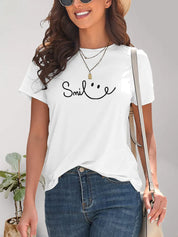 White SMILE graphic tee with black lettering, casual short sleeve
