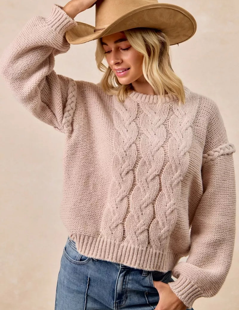 Dusty rose BiBi cable knit sweater with round neckline, long sleeves, shoulder braid