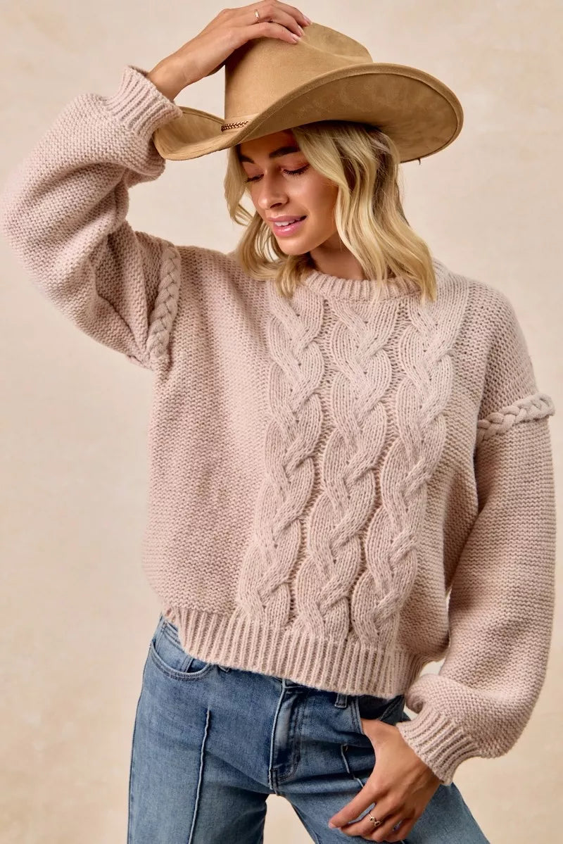 Dusty rose BiBi cable knit sweater with round neckline, long sleeves, shoulder braid