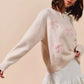 SO ME cream knit sweater with pink embroidered bows